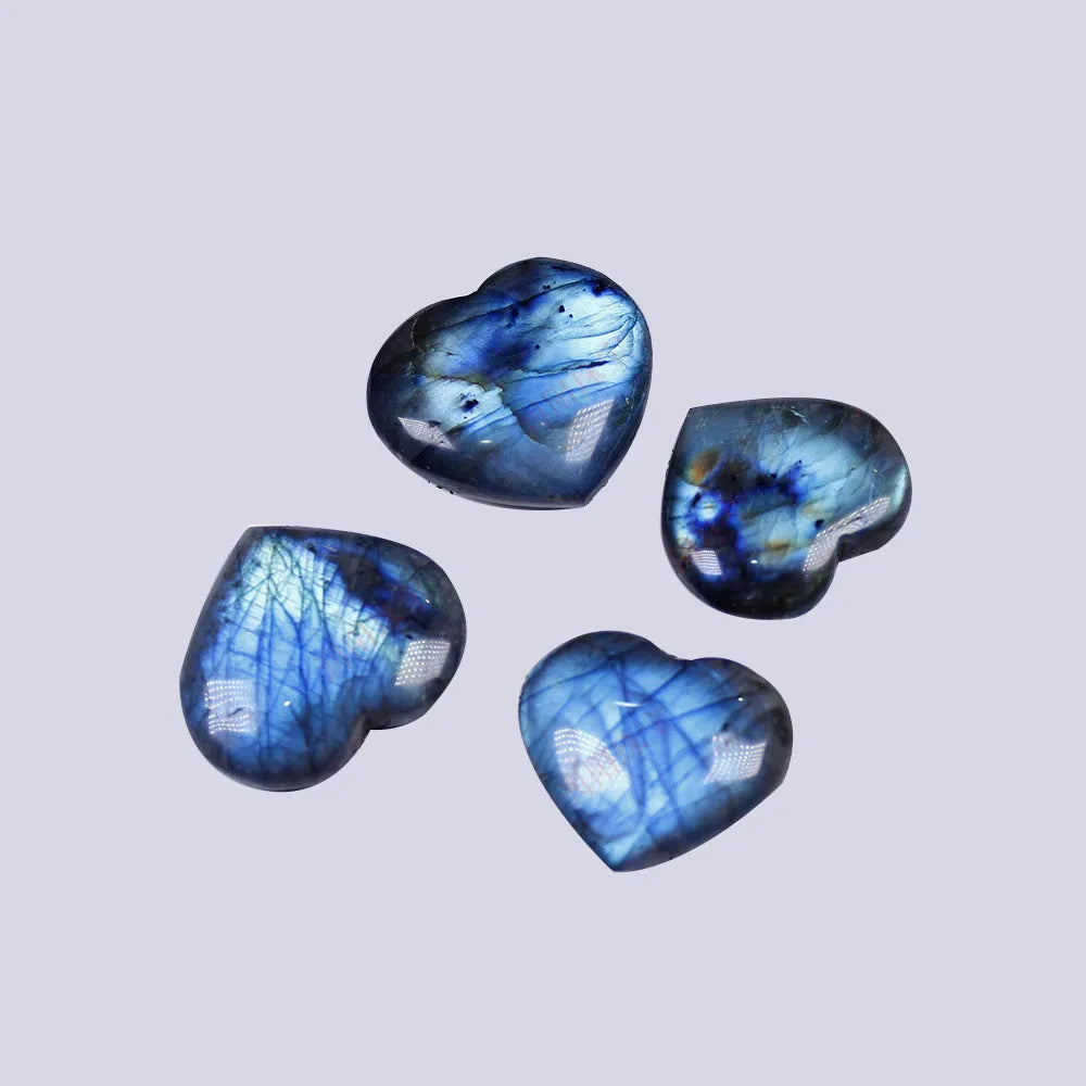 Natural blue pulled feldspar pendant with a geometric heart-shaped handle design on a white background.