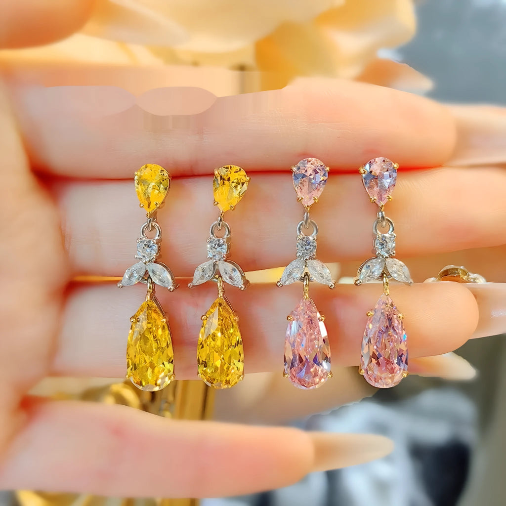 Pair of floral earrings in pink or yellow diamond finish with copper base and retro petal design