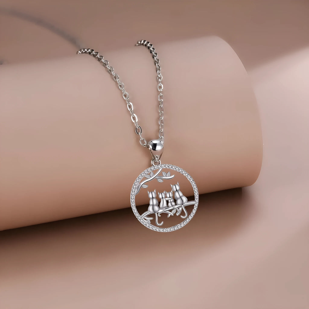 Copper cat pendant necklace with four kitten design and cross chain