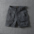 Men's straight-leg cotton cargo shorts with multiple pockets in khaki colour.
