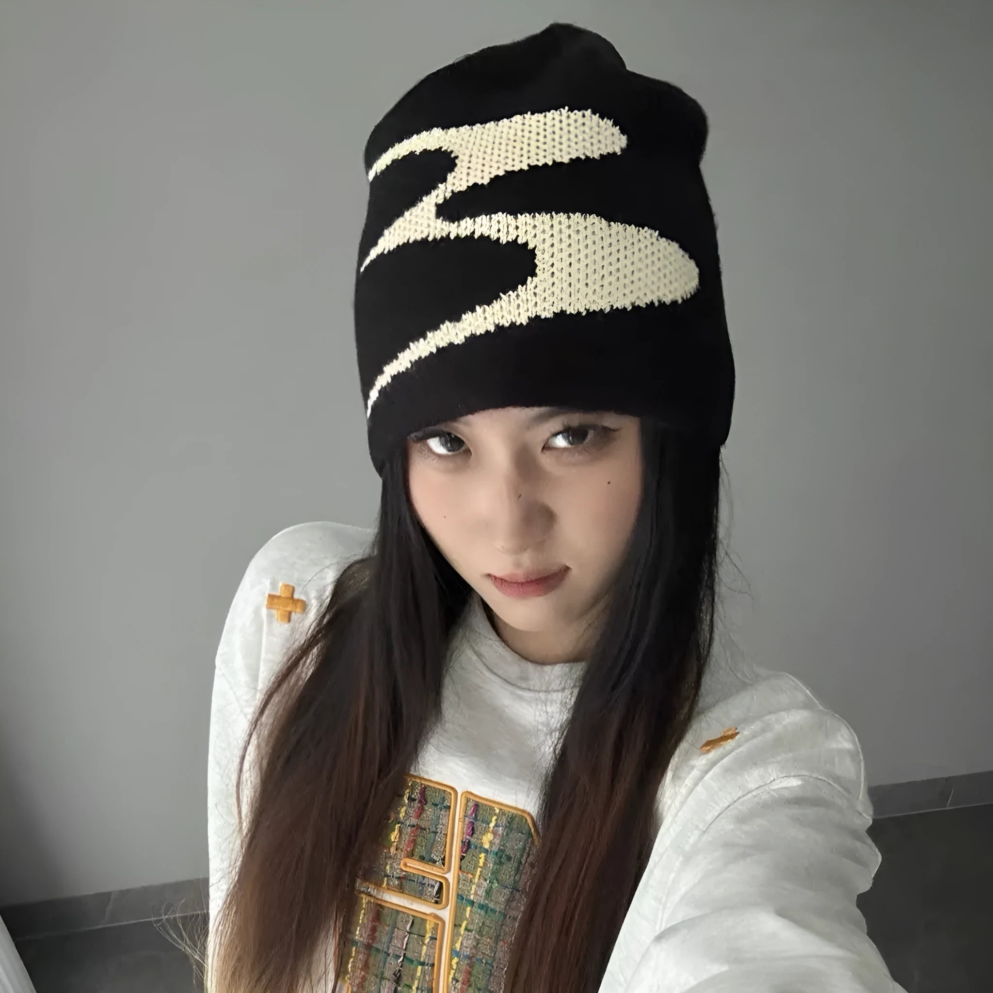 Acrylic thermal beanie hat in white colour showing woolen-style knitting texture