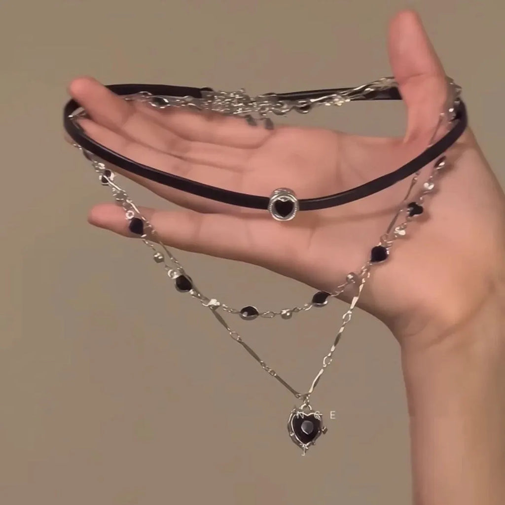 Women's leather heart necklace set showing double-layer and single-layer pendant designs on adjustable clavicle chain