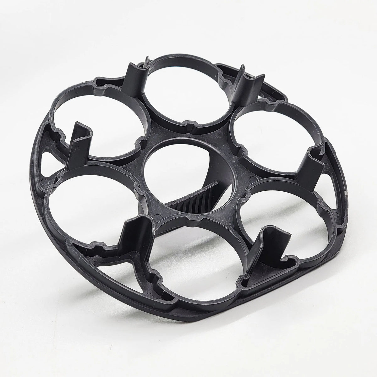 Black plastic egg holder basket for cooking machines measuring 13.8 x 12.6 x 5.7 cm