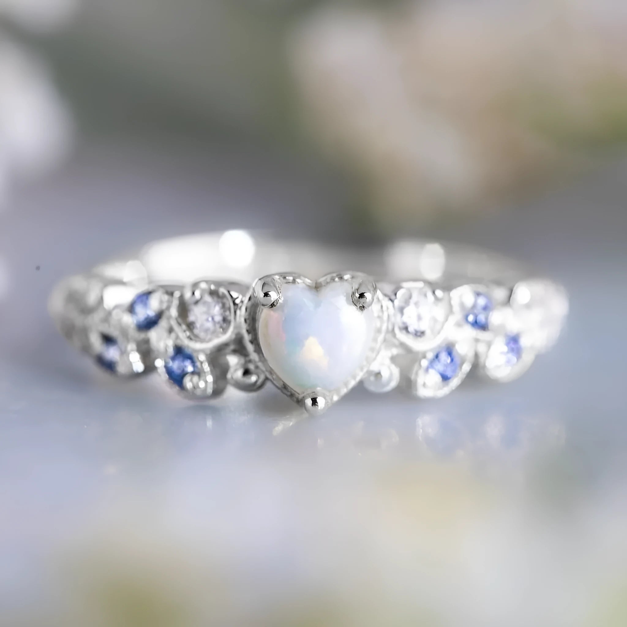 Women's white alloy peach heart ring with Flower Opal Ocean design showing detailed patterning