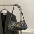 Women's casual PU handbag with sandwich pockets in black colour showing 27cm width