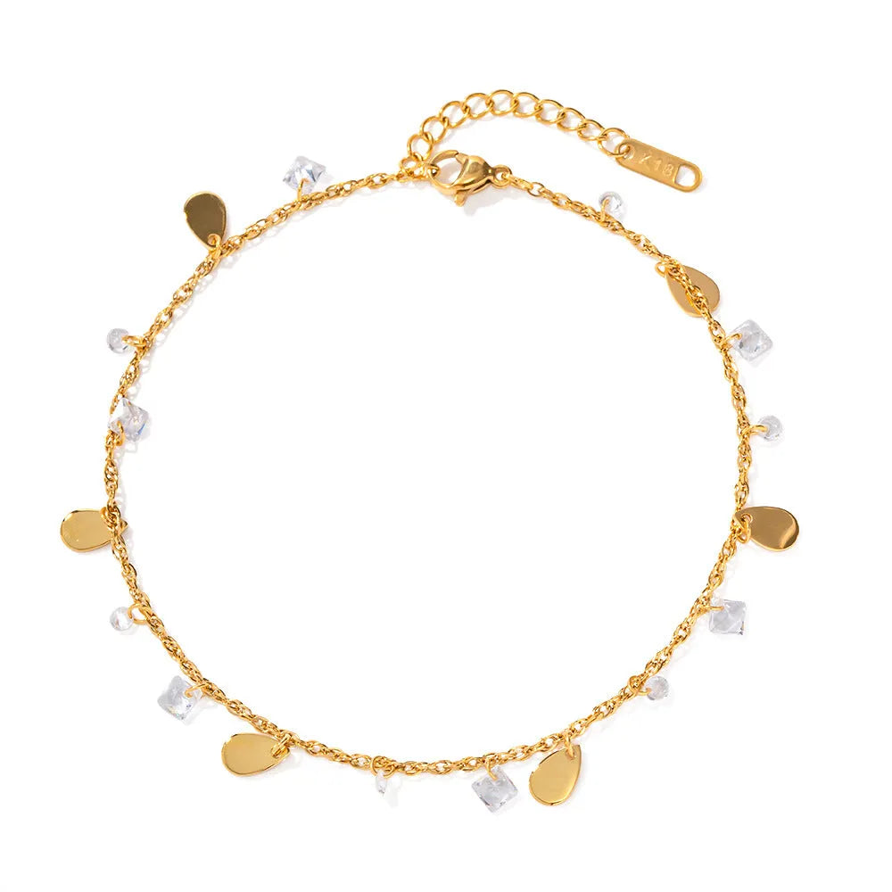 Silver-tone stainless steel anklet with a geometric water drop tassel charm on an adjustable chain.