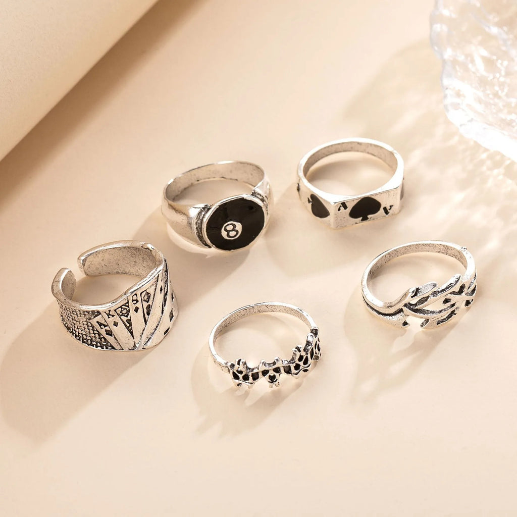 Black alloy poker ring with a raised retro spade card design on its face.