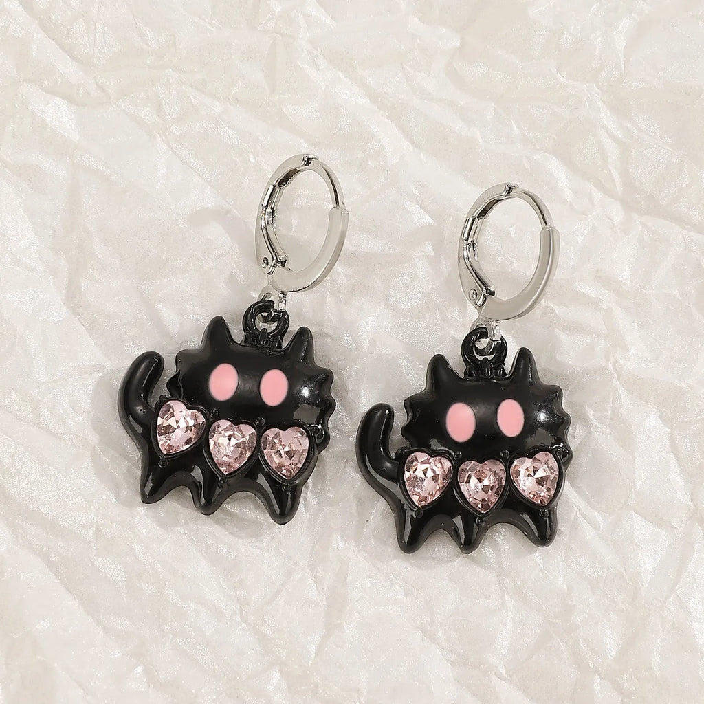 Women's alloy earrings with cross crystal designs in white, black cat, and antique silver colour options