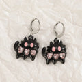 Women's alloy earrings with cross crystal designs in white, black cat, and antique silver colour options