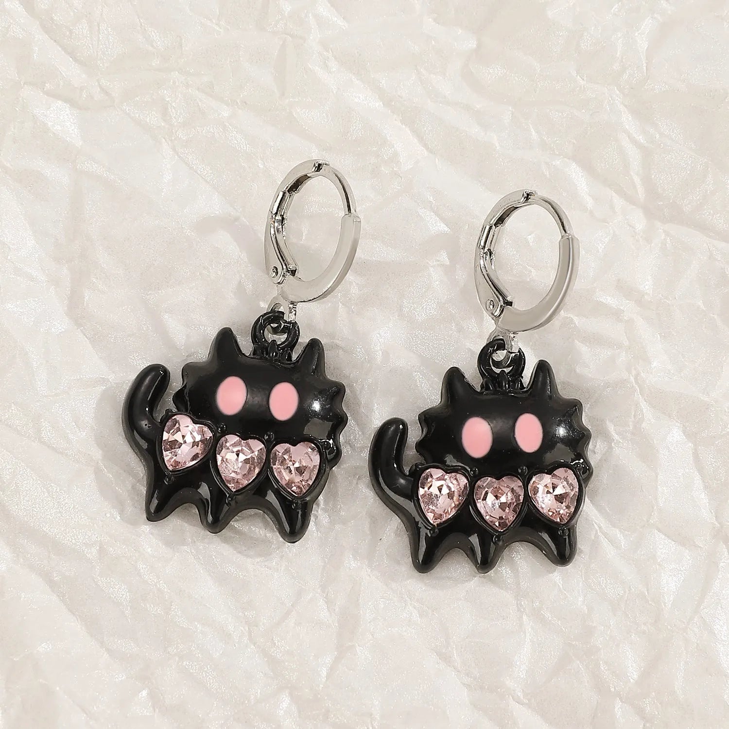 Women's alloy earrings with cross crystal designs in white, black cat, and antique silver colour options