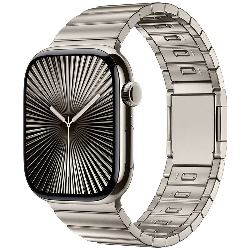 Stainless steel Apple Watch strap with magnetic fold-over buckle in silver colour.