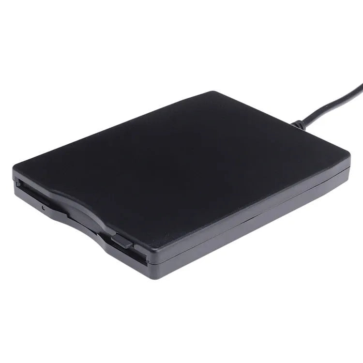 Black external USB 3.5-inch floppy disk drive on a desk for reading diskettes