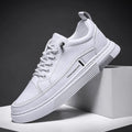 Men's black and white low-top skate shoes with elastic band and rubber sole