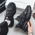 Men's beige and black mesh sneakers with rubber soles and lace-up front