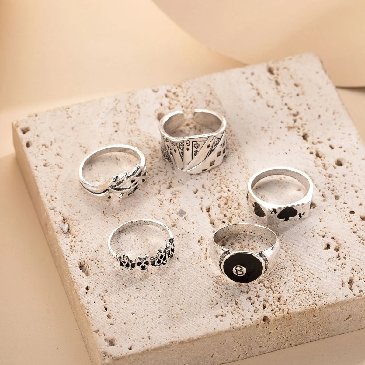 Black alloy poker ring with a raised retro spade card design on its face.