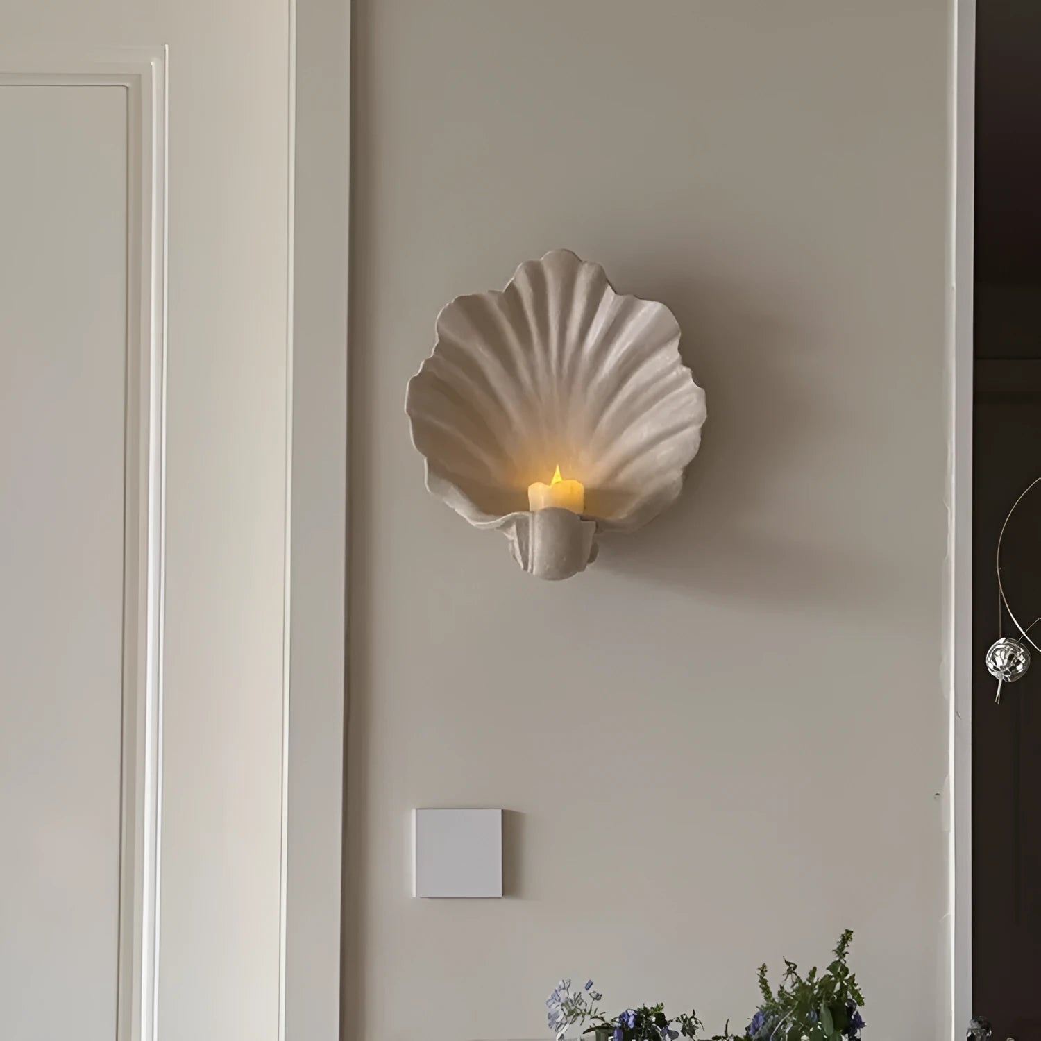 White resin fruit plate ornament with detailed simulation shell design on a table.