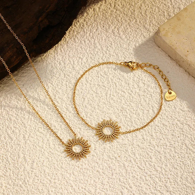 Gold-tone geometric chain necklace and bracelet set with sunflower design on stainless steel