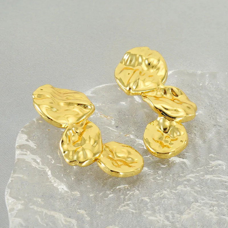 Gold stainless steel vintage petal earrings with irregular geometric shape and asymmetric folding design