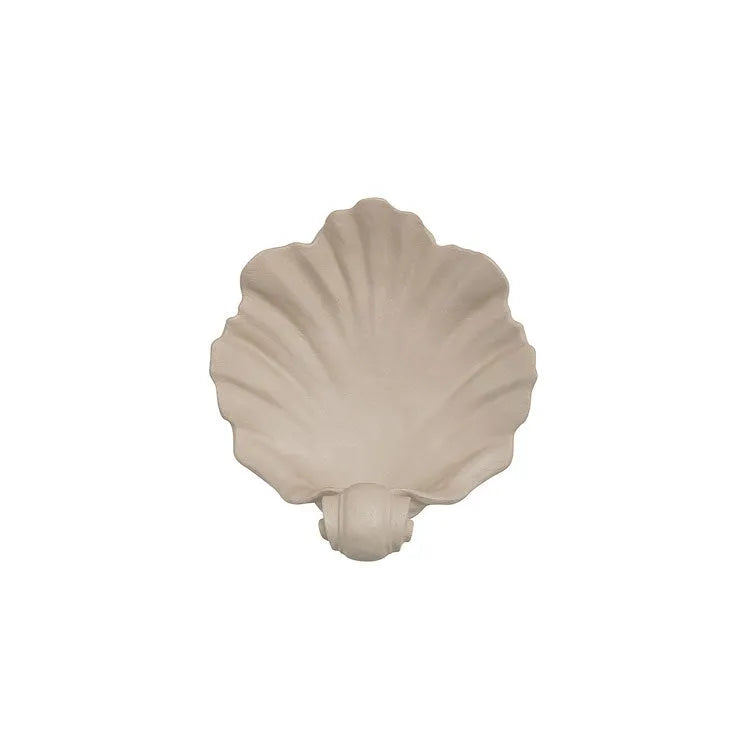 White resin fruit plate ornament with detailed simulation shell design on a table.
