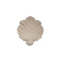 White resin fruit plate ornament with detailed simulation shell design on a table.