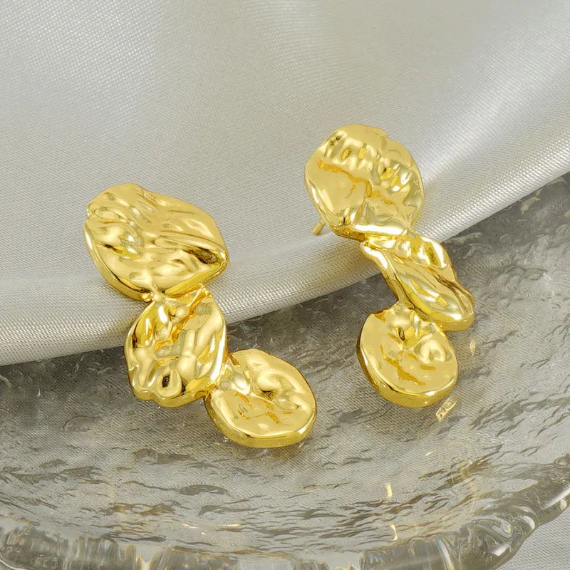 Gold stainless steel vintage petal earrings with irregular geometric shape and asymmetric folding design