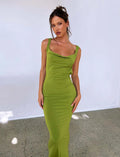 Backless sling style dress with spaghetti straps in milk silk fabric, shown in champagne colour with slim fit silhouette