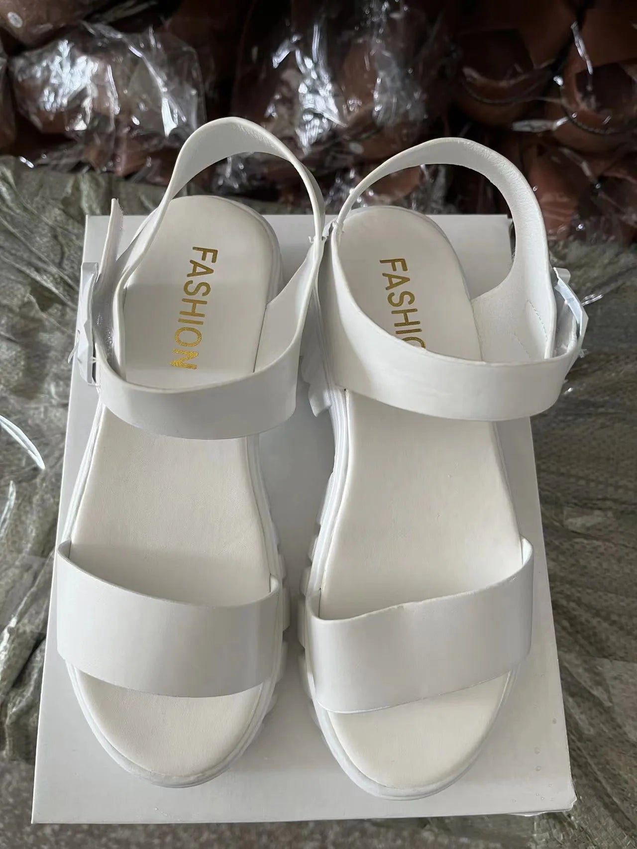 Women's beige peep toe ankle-strap buckle platform sandals in college style on a white background.