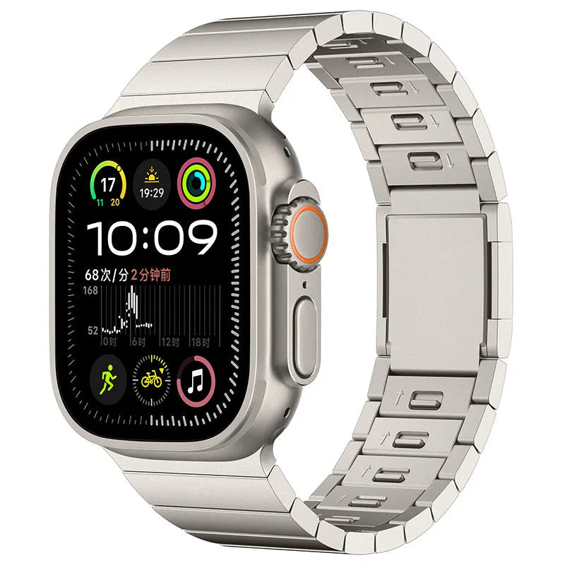 Stainless steel Apple Watch strap with magnetic fold-over buckle in silver colour.