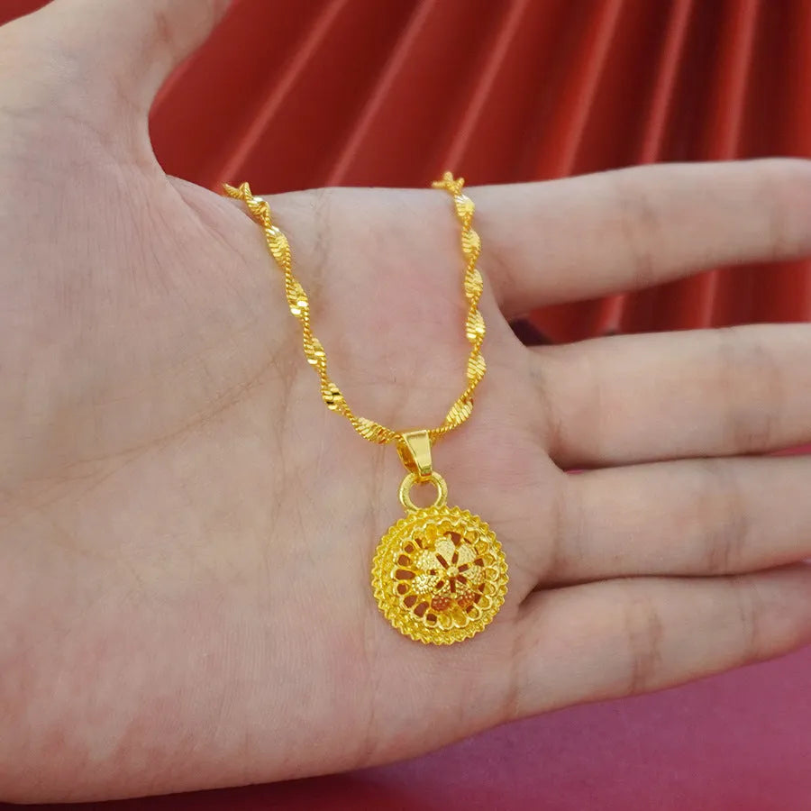 Gold-plated three-piece jewellery set with flower design, including necklace, earrings and ring