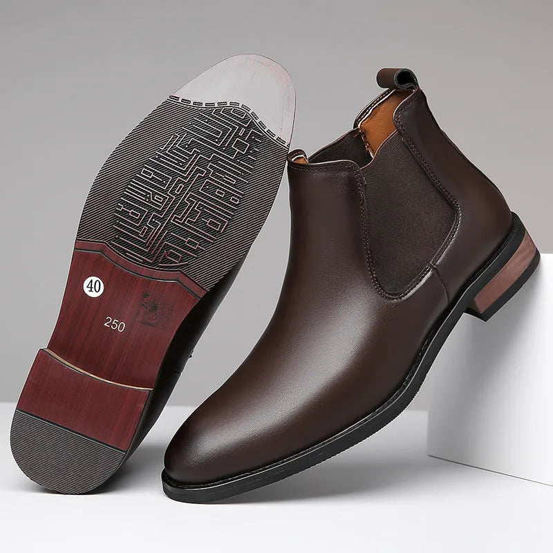 Men's black pointed-toe Chelsea boots with a high-top design and rubber sole on a white background.