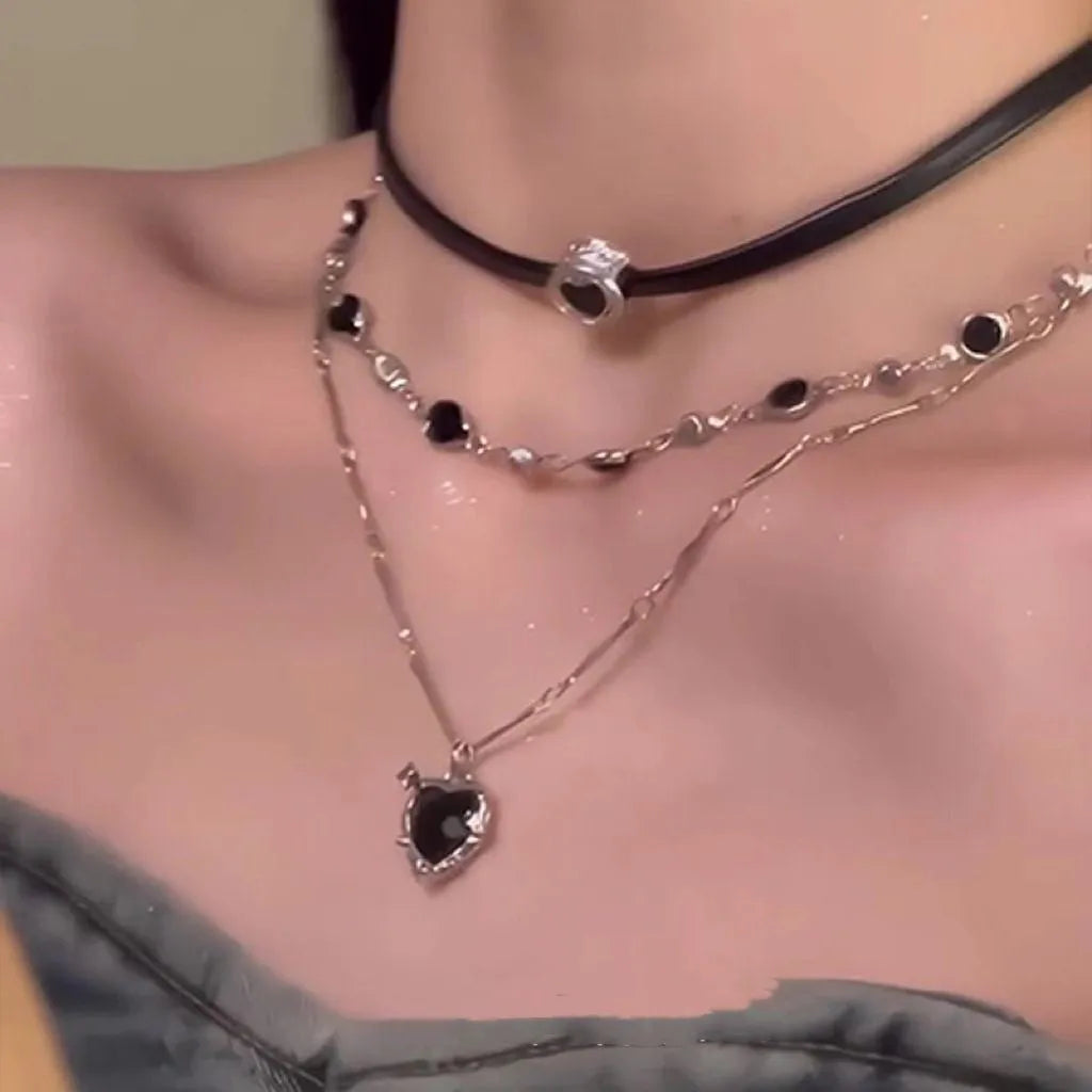 Women's leather heart necklace set showing double-layer and single-layer pendant designs on adjustable clavicle chain