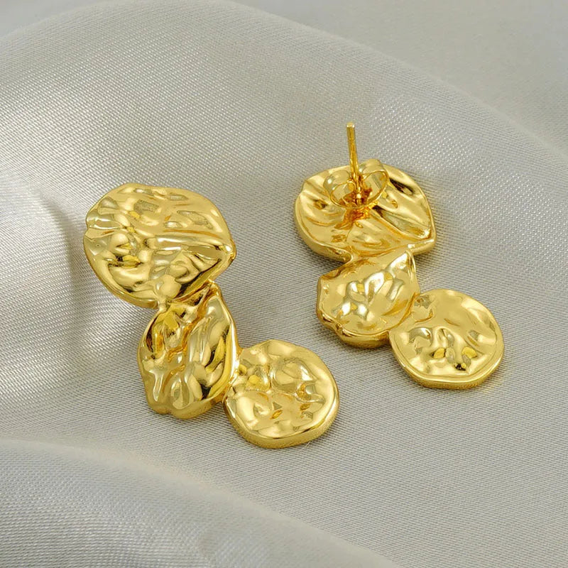 Gold stainless steel vintage petal earrings with irregular geometric shape and asymmetric folding design