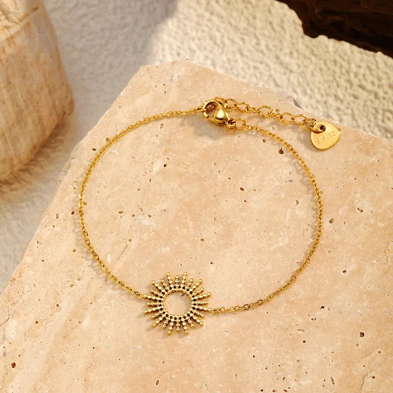 Gold-tone geometric chain necklace and bracelet set with sunflower design on stainless steel