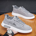 Grey men's casual canvas shoes with round toe and lace-up design featuring breathable construction