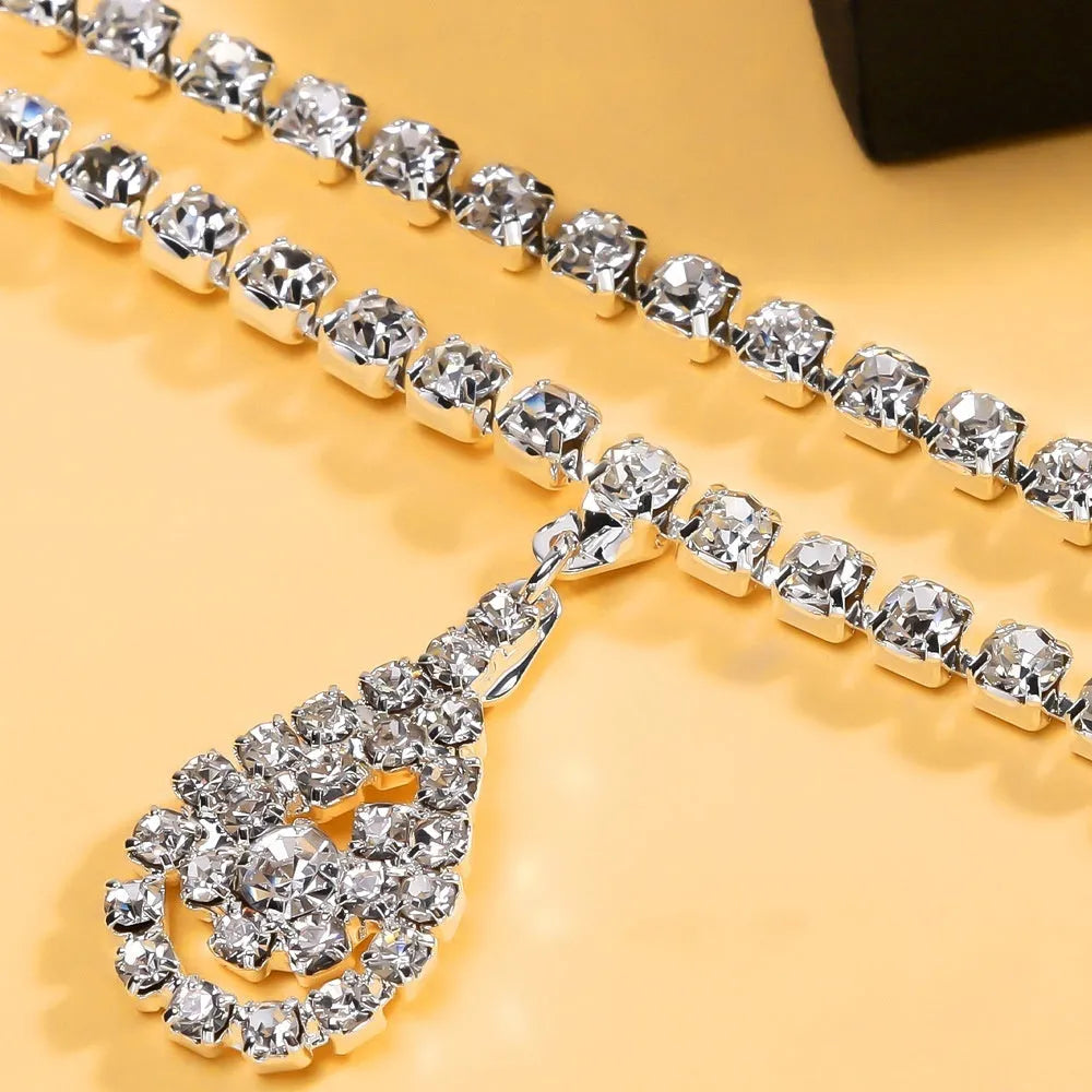Gold or silver waist chain with water drop pendant and rhinestone accents, lobster buckle clasp