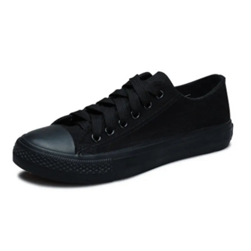 Women's solid colour canvas casual shoes in black, white black, white red and all black colour options.