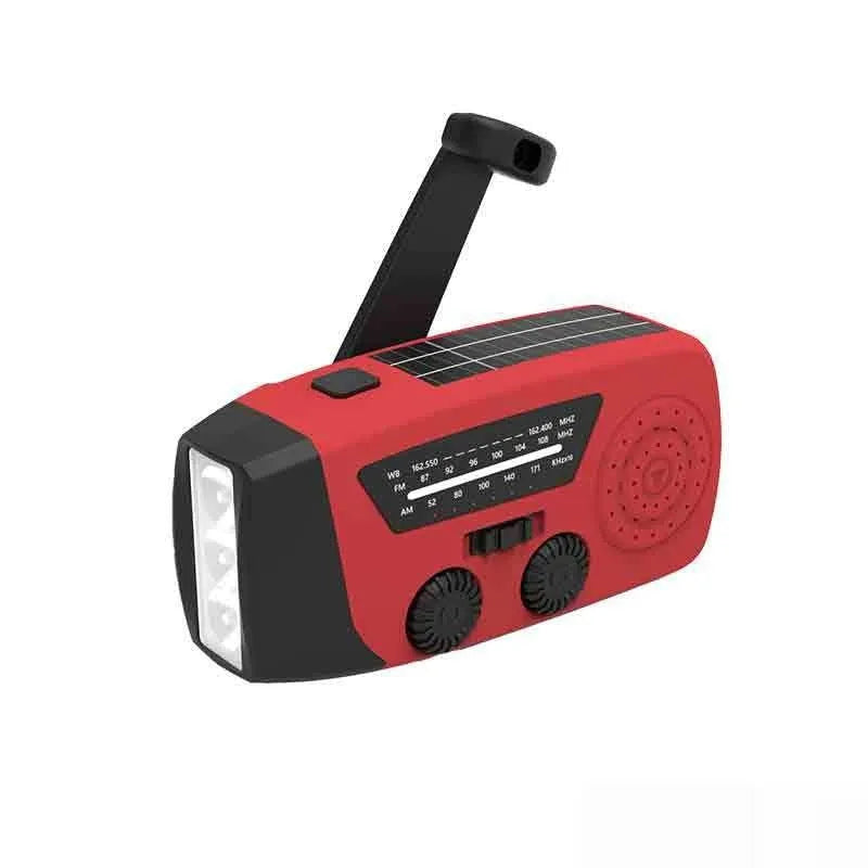 Red rechargeable emergency hand radio torch with USB port and wrist strap for disaster preparedness