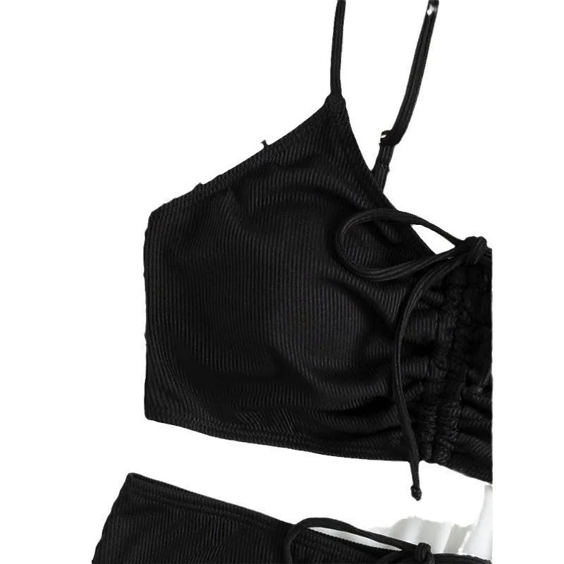 Black women's swimsuit with high waist bottoms and sleeveless top on mannequin