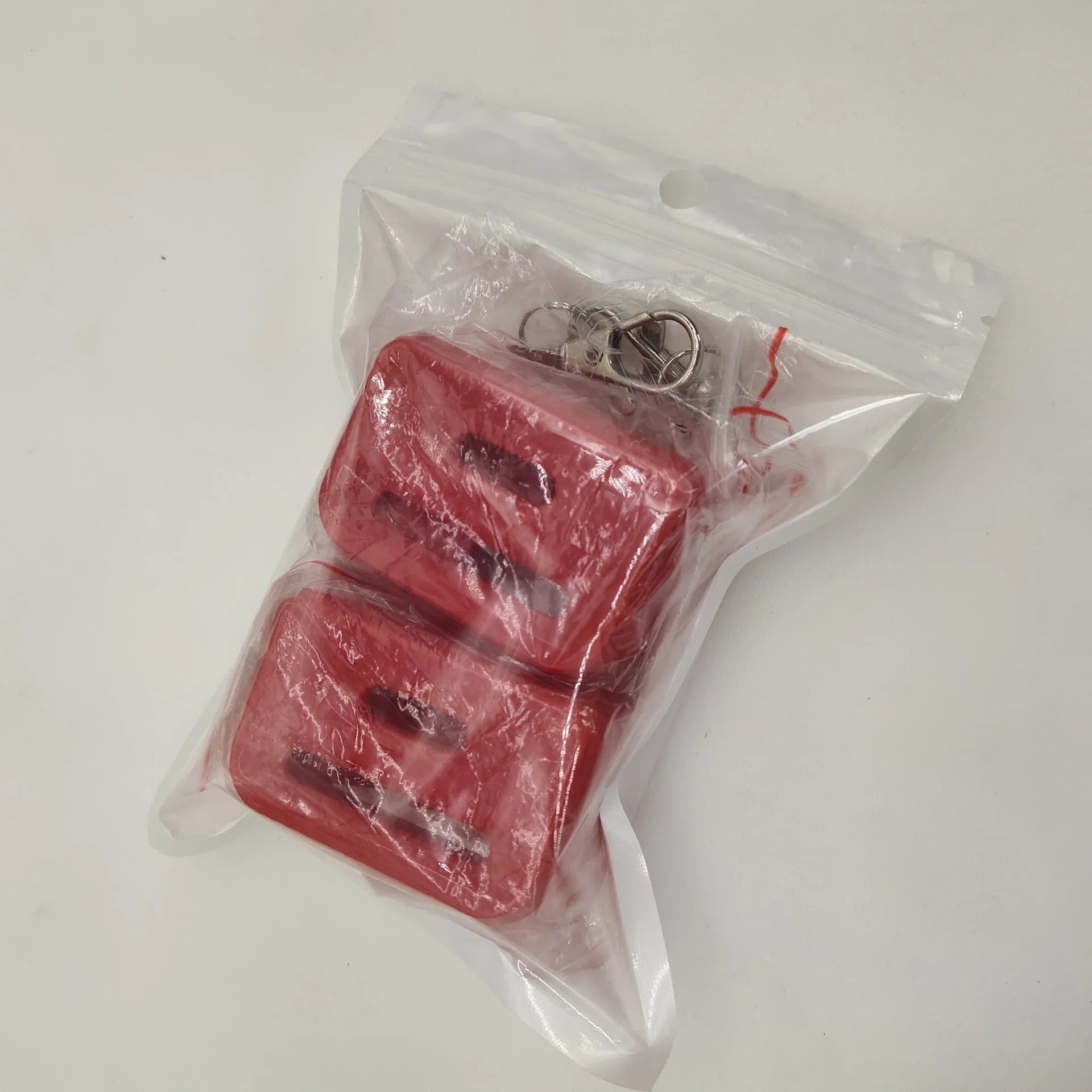 Black and red seat belt lock protective clamp made from ABS plastic