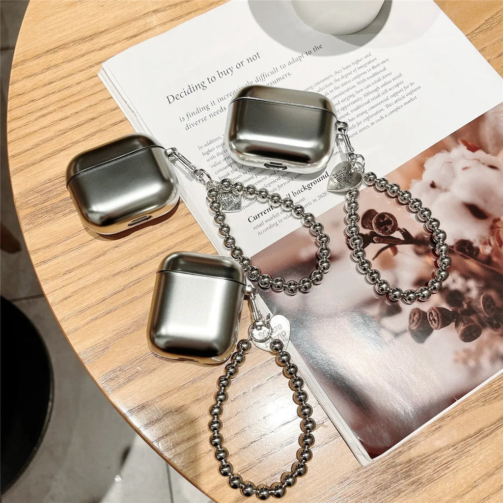 Matte plating protective case for Apple AirPods with an integrated carrying strap.