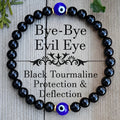 Men's black beaded bracelet with 8mm devil's eye beads and 6mm black beads in a geometric design.
