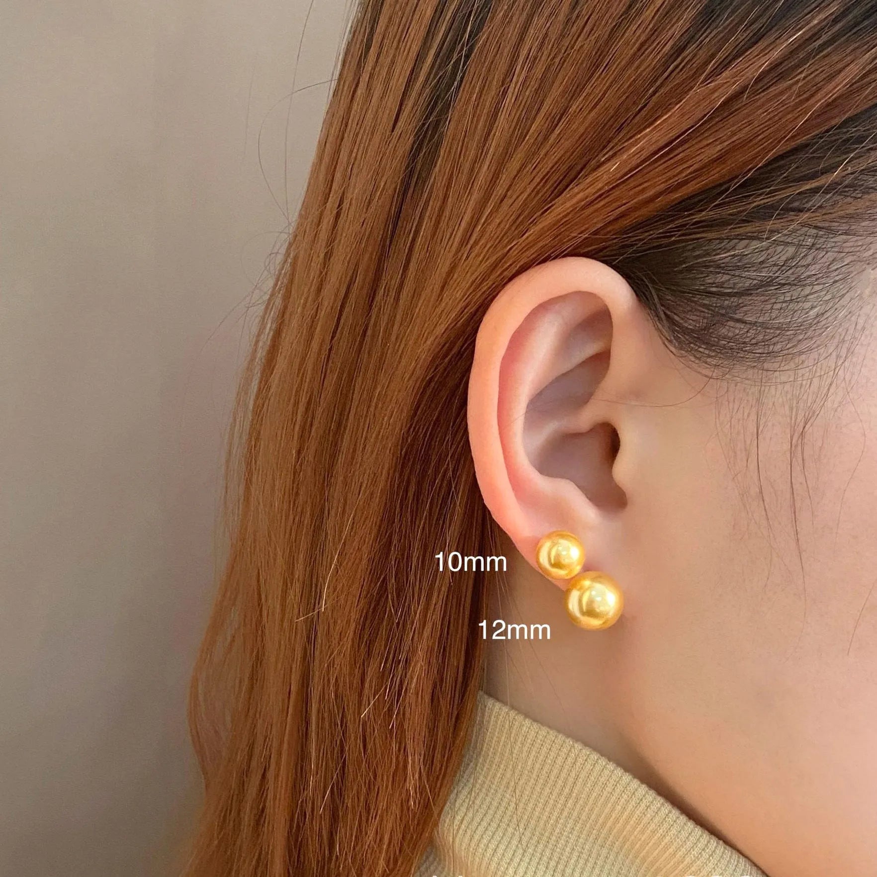 Large pearl stud earrings with geometric silver settings and eight-pointed star details