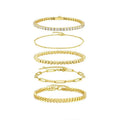 Five stacked S925 silver gold bracelets with round moissanite stones in geometric mosaic design on white background