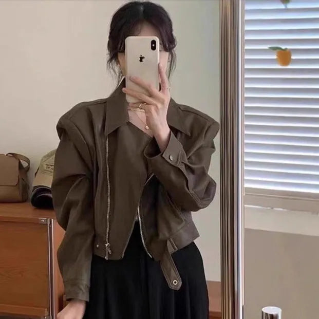 Women's brown retro leather coat jacket with slim fit design and pocket detailing