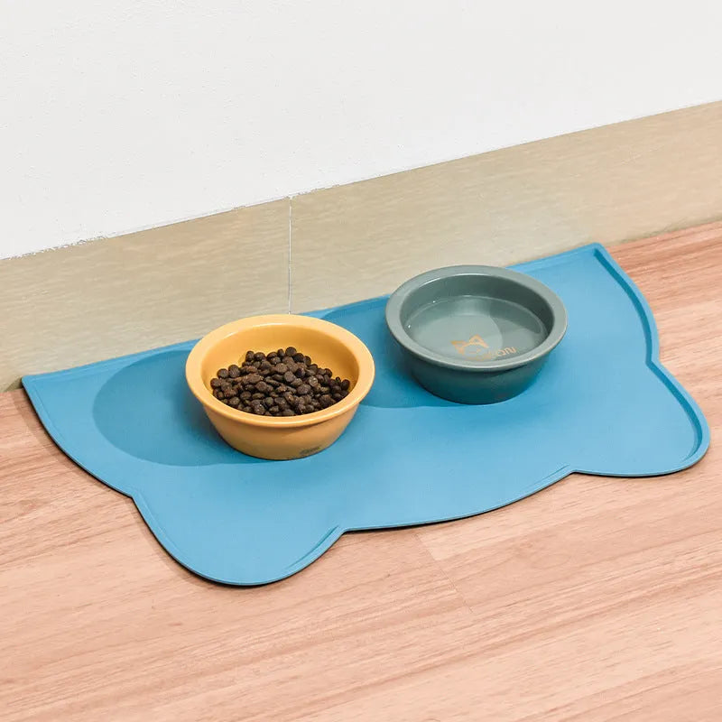 Silicone pet mat for cats and dogs with lock edge and anti-skid base, available in grey, blue and pink styles.