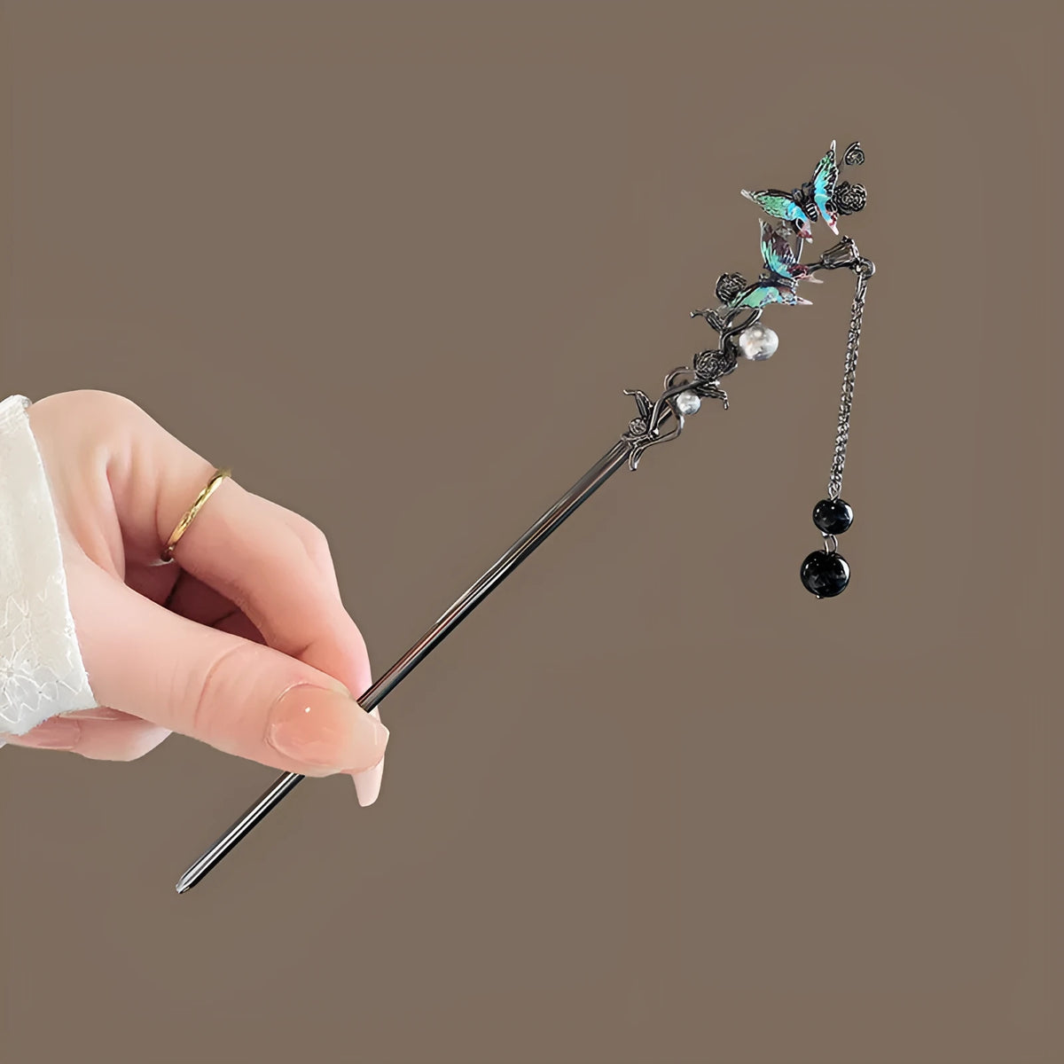 Four Seasons National Style green leaf tassel Hanfu hairpin with pearl and rhinestone details on a white background