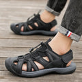 Men's blue casual sports shoe with mesh upper and Velcro strap on a rubber sole.