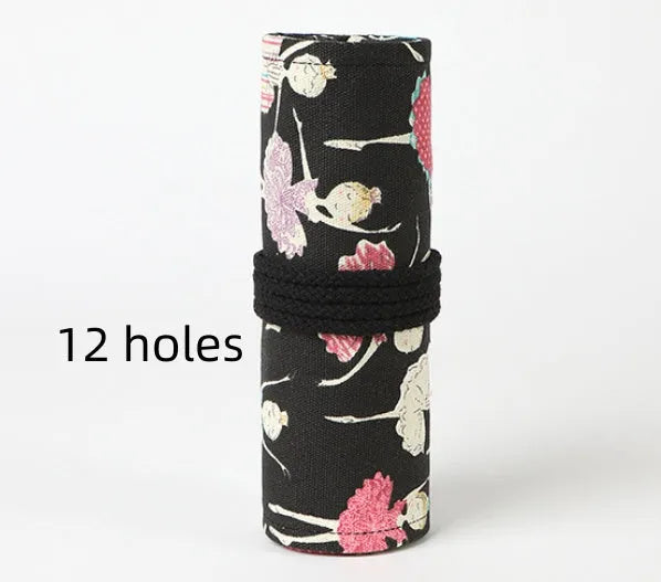 Rolled-up canvas pencil case with ballet girl print, showing multiple pencil slots.