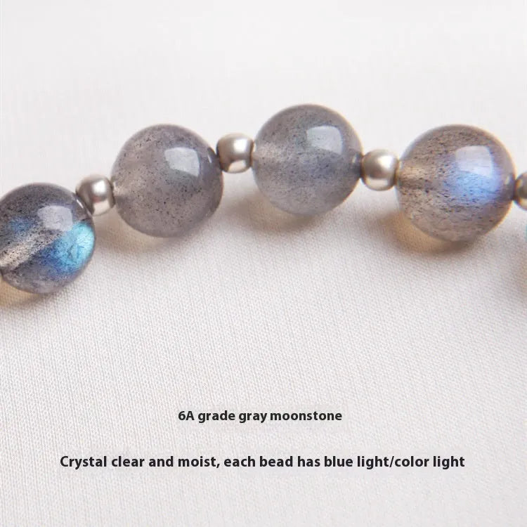 Women's crystal bracelet with grey moonlight 7.5mm beads and animal zodiac charms