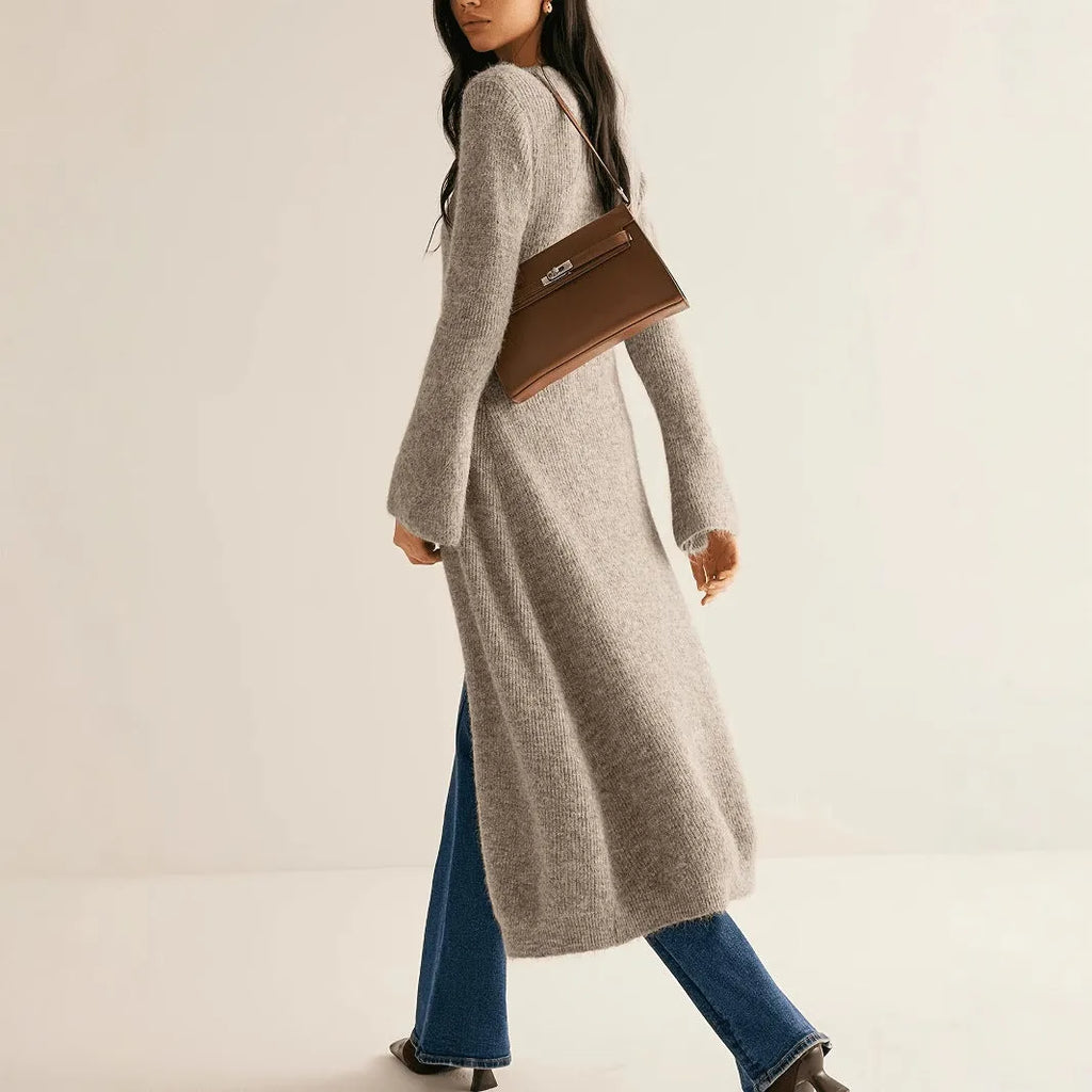 Khaki coloured long sleeve button-front cardigan with a French retro style on a hanger.